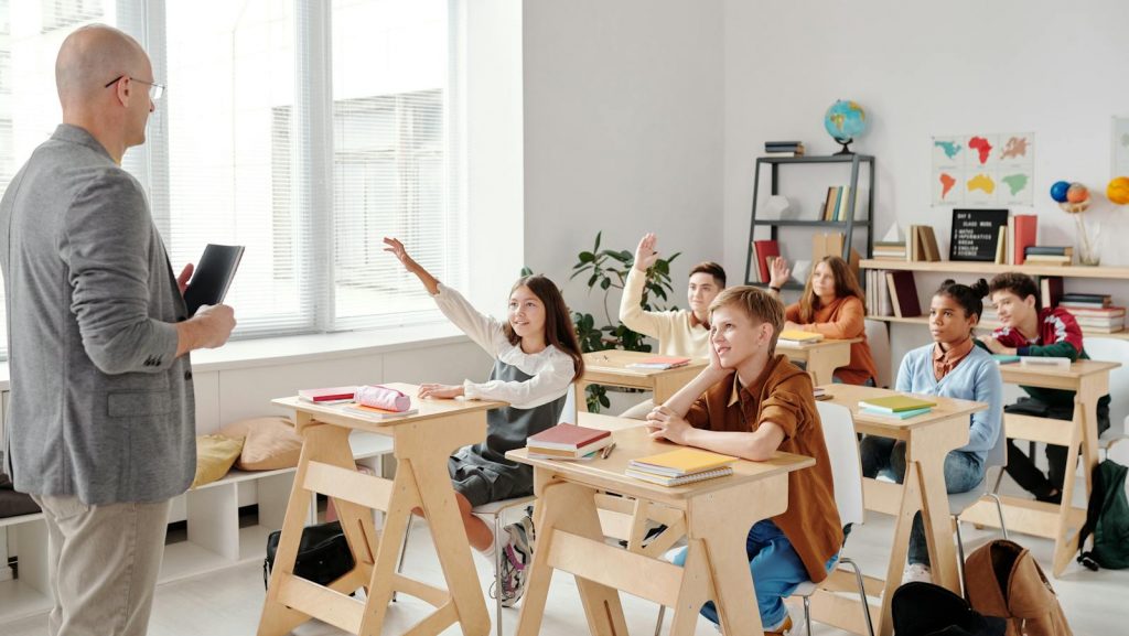 Students Raising their Hands in the Classroom