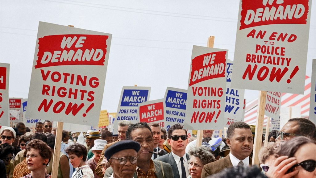 Marchers holding signs demanding the right to vote at the March on Washington